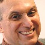 a close-up of a man smiling