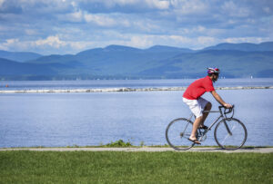 A biker enjoys the paths along the river. burlington-biking