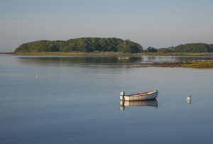 A lonely dingy sits in wait on a beautiful summer day. kennebunk-jd-lazy-day-dinghy
