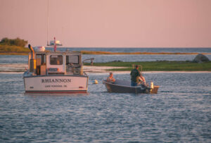 A couple heads out to their awaiting lobster boat. kennebunk-jd-lobster-boat-rhiannon