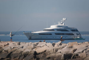 Visiting mega yachts often anchor outside the river. kennebunk-jd-megayacht