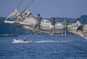 Tending to the headsail. Photo/Joe Devenney camden-jd-tending-sail-windjammer