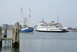 Ferries and commercial fishermen share the waters with recreational boaters. point-judith-az-ferry-and-commercial-fishing