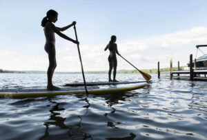 Paddleboarding is a great way to explore Winnisquam’s placid coves. winnisquam-nh-kb-paddle-boarders
