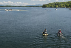 Jet skis are common on the lake. winnisquam-nh-kb-riding-see-doo
