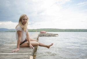 Winnisquam is the ideal lake for those who simply want to kick back and dip their feet in the water. winnisquam-nh-kb-sitting-on-dock