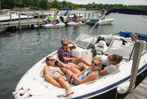 Teens take a lake break at the Back Bay docks. wolfeborough-kb-hanging-out