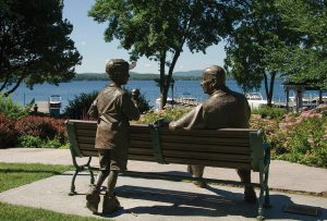 A statue and bench at Cate Park reflect a summer moment, frozen in time. wolfeborough-kb-statue-cate-park