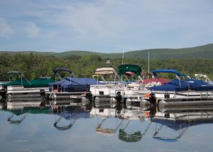 Pontoon boats at the docks at O’Hara’s Landing Marina & Restaurant on East Twin Lake. litchfield-lakes-cd-pontoon-boats