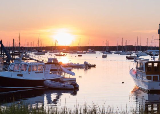 Power and sailboats rest as the day ends over Red Brook Harbor. Photo/Parker's Boatyard red-brook-harbor-parkers-boatyard-power-sunset