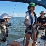 women-in-sailing-helm-photo-narragansett-sailing-and-boating-school